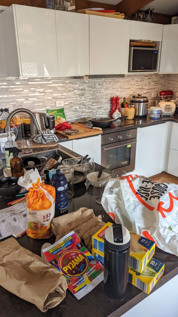 My kitchen bench before decluttering excuses and just doing the job of tidying up!